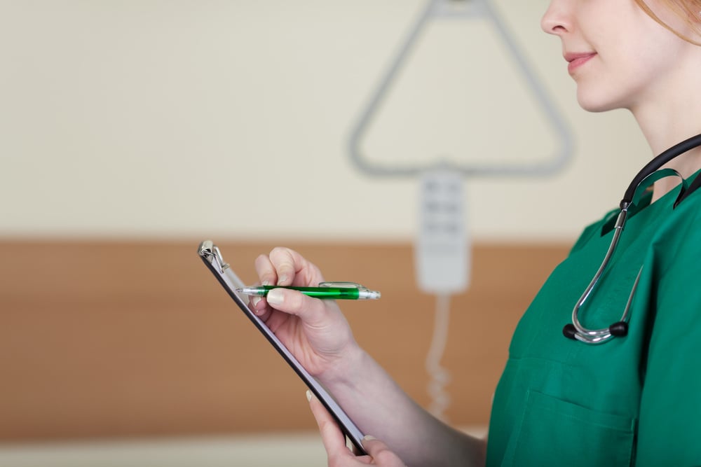 woman-doctor-or-nurse-taking-notes