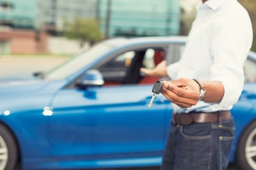 man-offers-keys-to-new-car-what-is-maximum-auto-cost-for-FAVR-allowance-2023