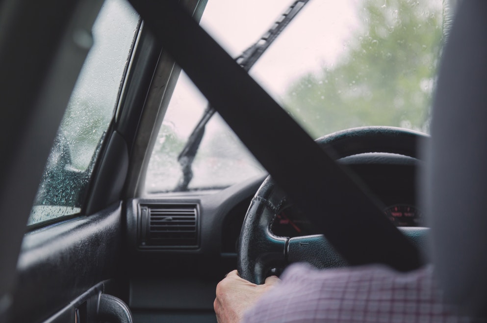 driver-with-wipers-rainy-road-accident-risk
