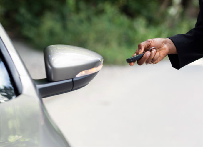 hand-with-key-fob-locking-company-car